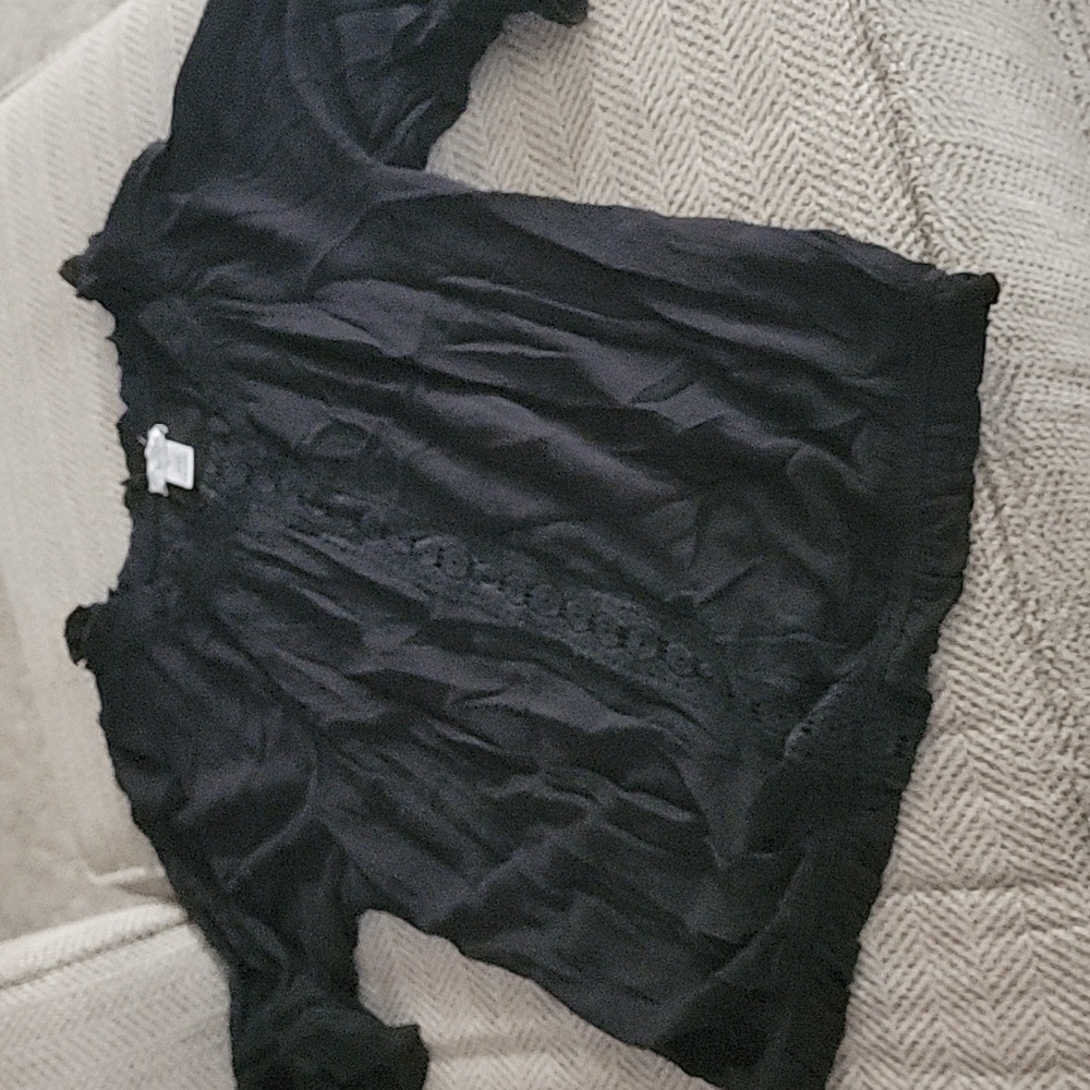 Flowy soft top.  Crochet/lace strip down the front